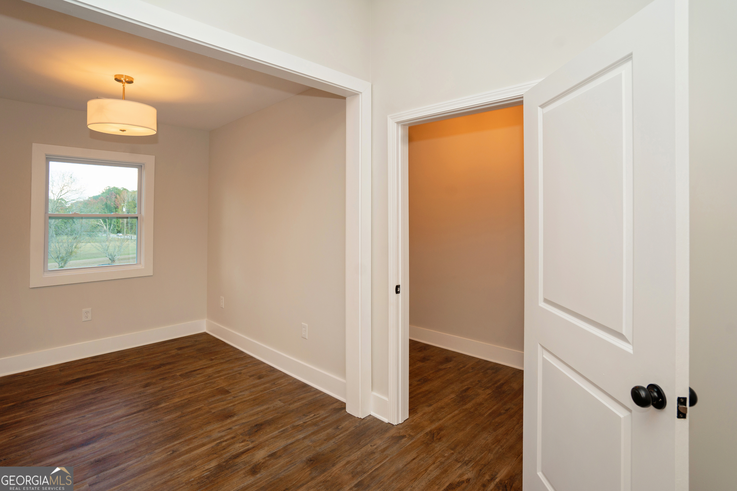 269 Martin Dairy Road Milner, GA 30257 - Photo 35 of 71 an empty room with wooden floor and windows