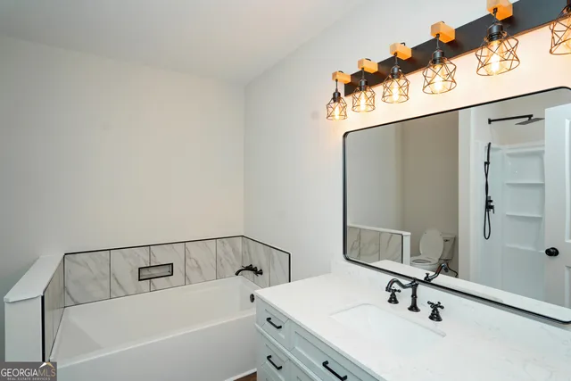 a view of a yard with a large tree