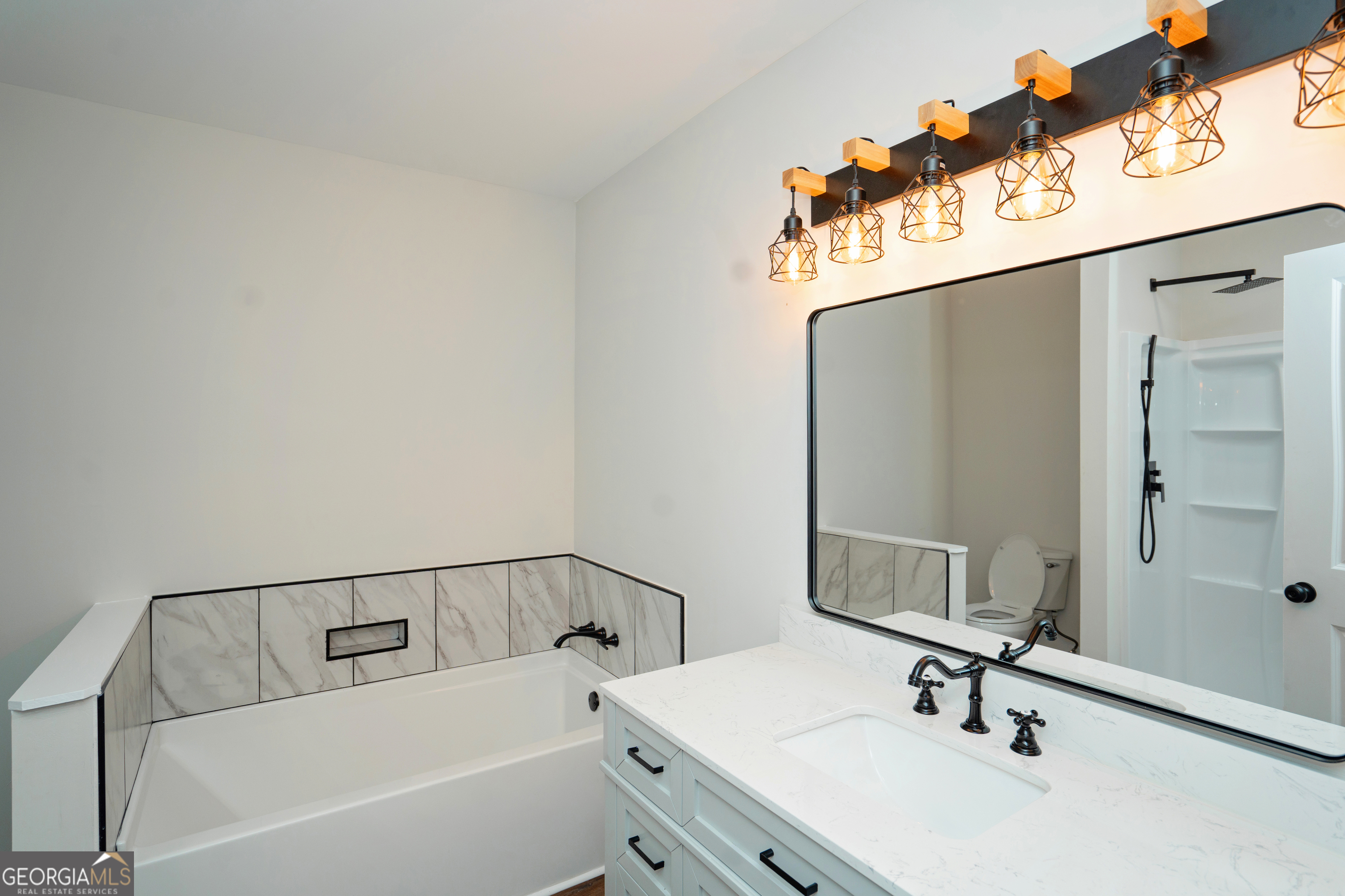 269 Martin Dairy Road Milner, GA 30257 - Photo 36 of 71 a bathroom with a sink and a mirror