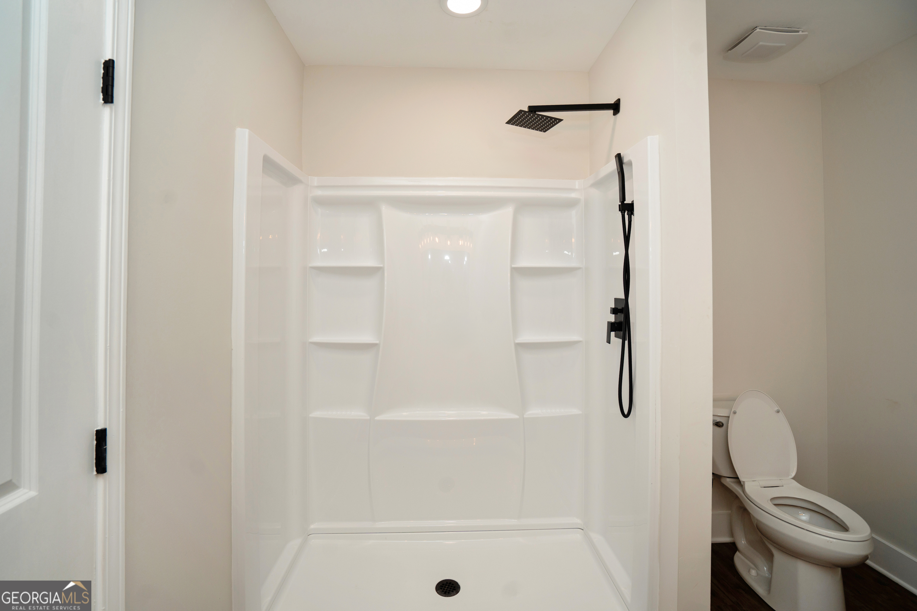 269 Martin Dairy Road Milner, GA 30257 - Photo 39 of 71 a bathroom with a shower and a toilet