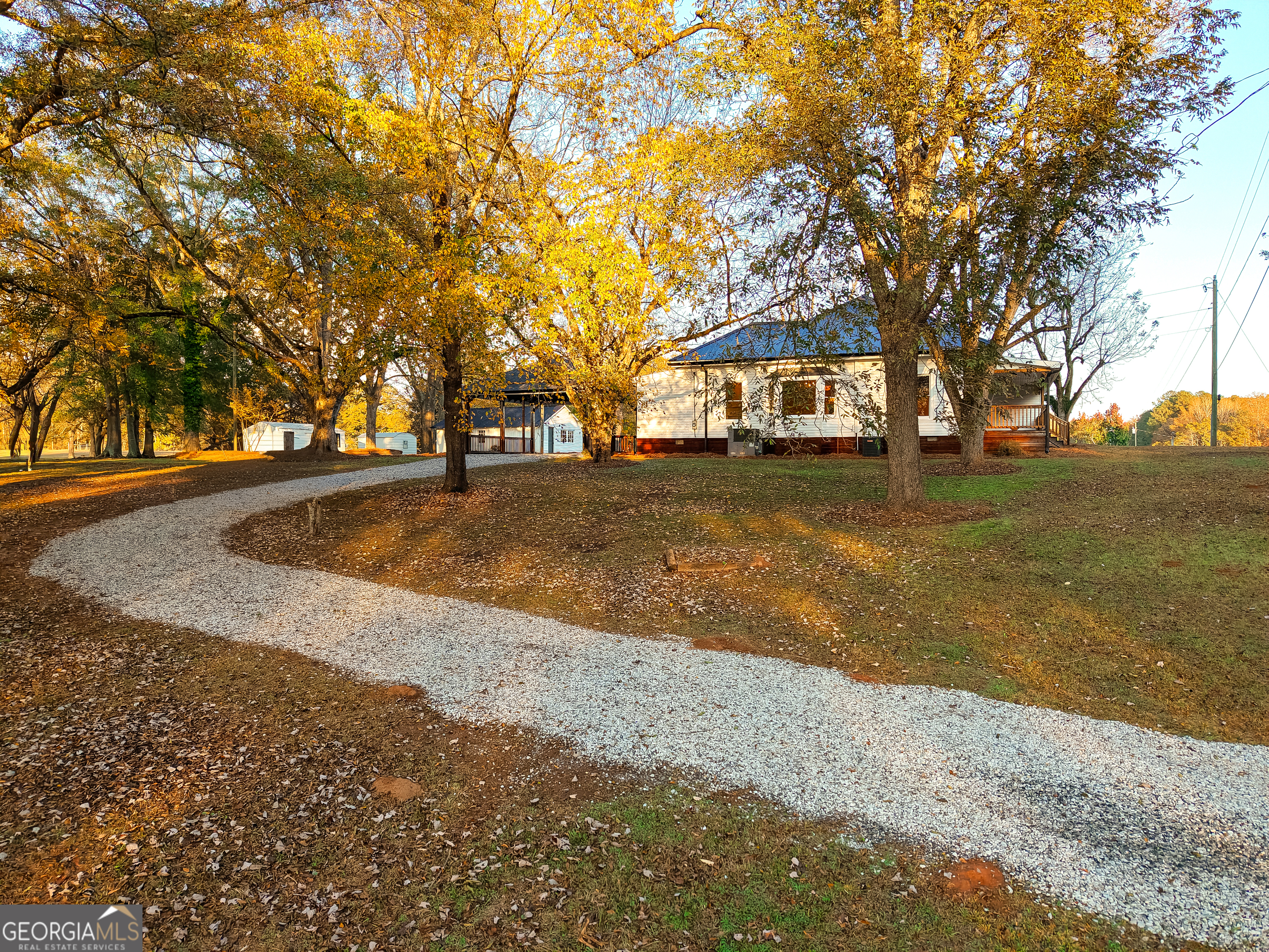 269 Martin Dairy Road Milner, GA 30257 - Photo 56 of 71 a front view of a house with a yard and trees