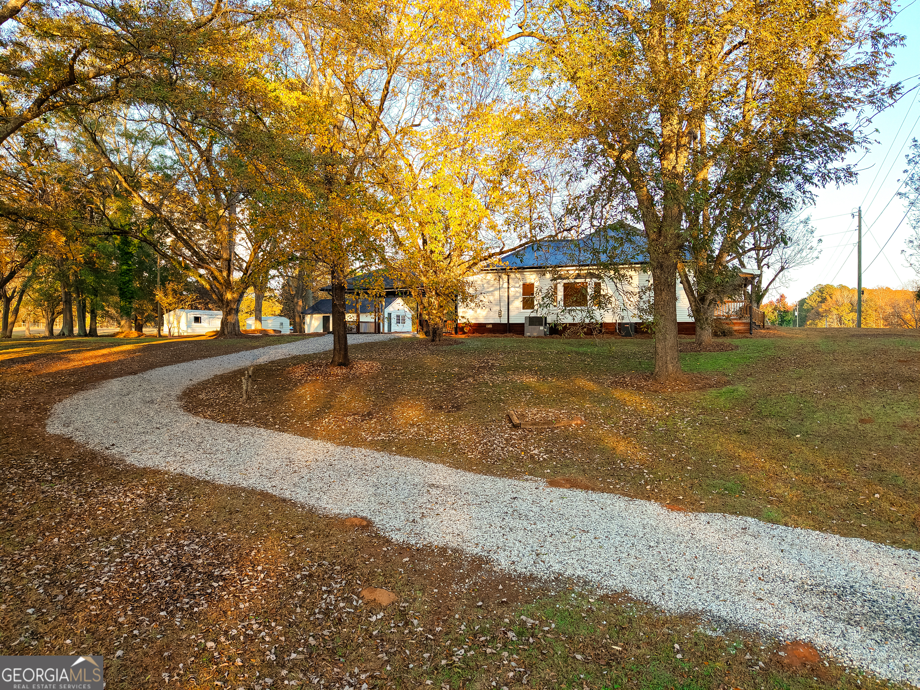 269 Martin Dairy Road Milner, GA 30257 - Photo 58 of 71 a front view of a house with a yard and trees