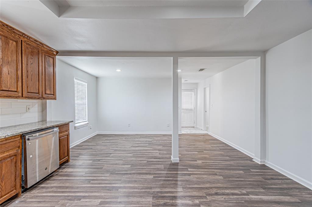 605 Lloyd Italy, TX 76651 - Photo 18 of 30 a view of an empty room and wooden floor