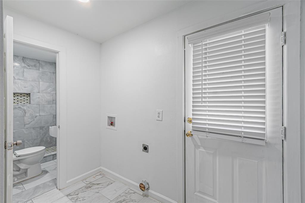605 Lloyd Italy, TX 76651 - Photo 19 of 30 a bathroom with a granite countertop toilet and a shower