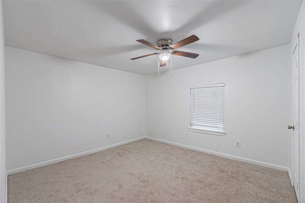 605 Lloyd Italy, TX 76651 - Photo 22 of 30 an empty room with windows and fan