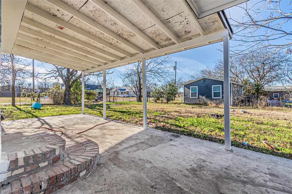605 Lloyd Italy, TX 76651 - Photo 27 of 30 a view of a house with backyard and porch with a backyard