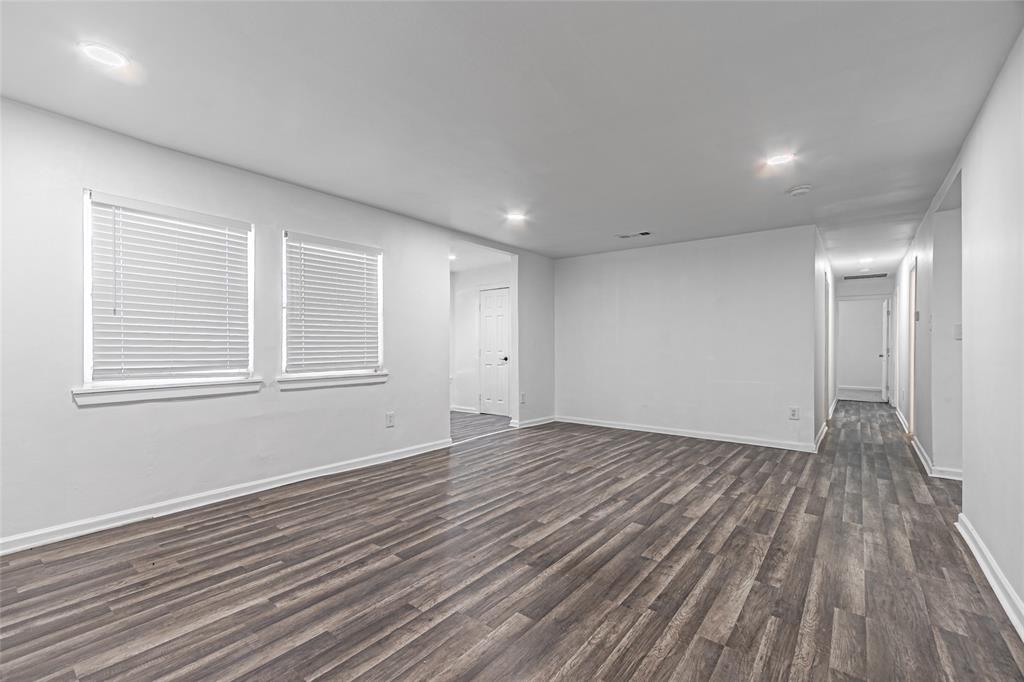 605 Lloyd Italy, TX 76651 - Photo 7 of 30 a view of empty room with wooden floor and fan