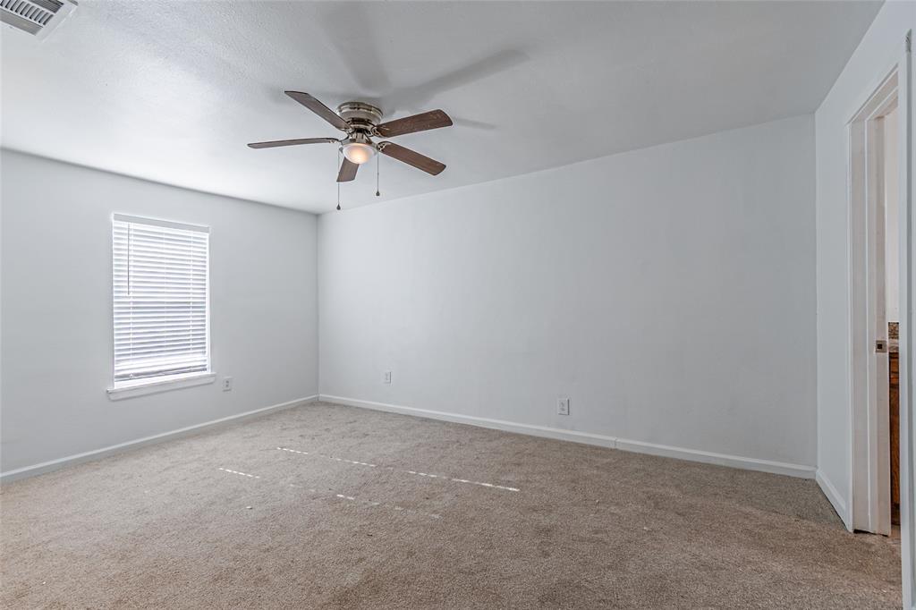 605 Lloyd Italy, TX 76651 - Photo 10 of 30 an empty room with windows and fan