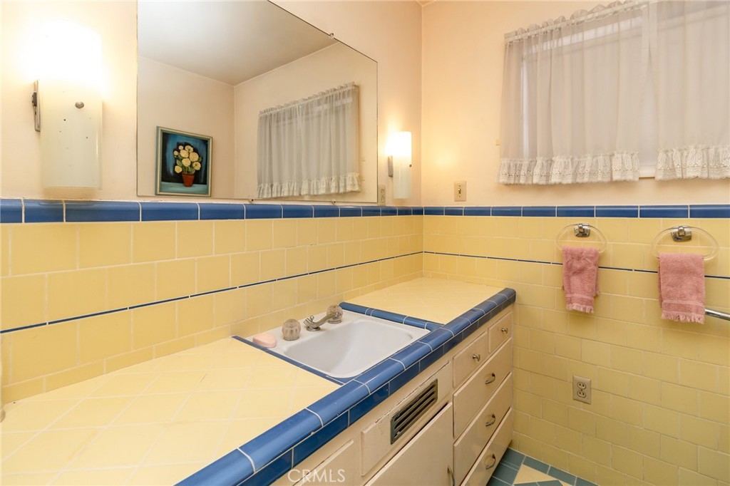 630 Acoma Street Needles, CA 92363 - Photo 20 of 60 a bathroom with a sink and a mirror