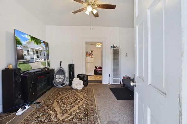 a bedroom with furniture and a dresser