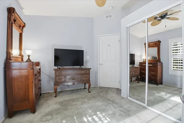 a view of a livingroom with furniture and a flat screen tv