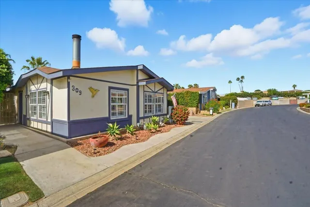 a view of a wrought iron fences in front of house
