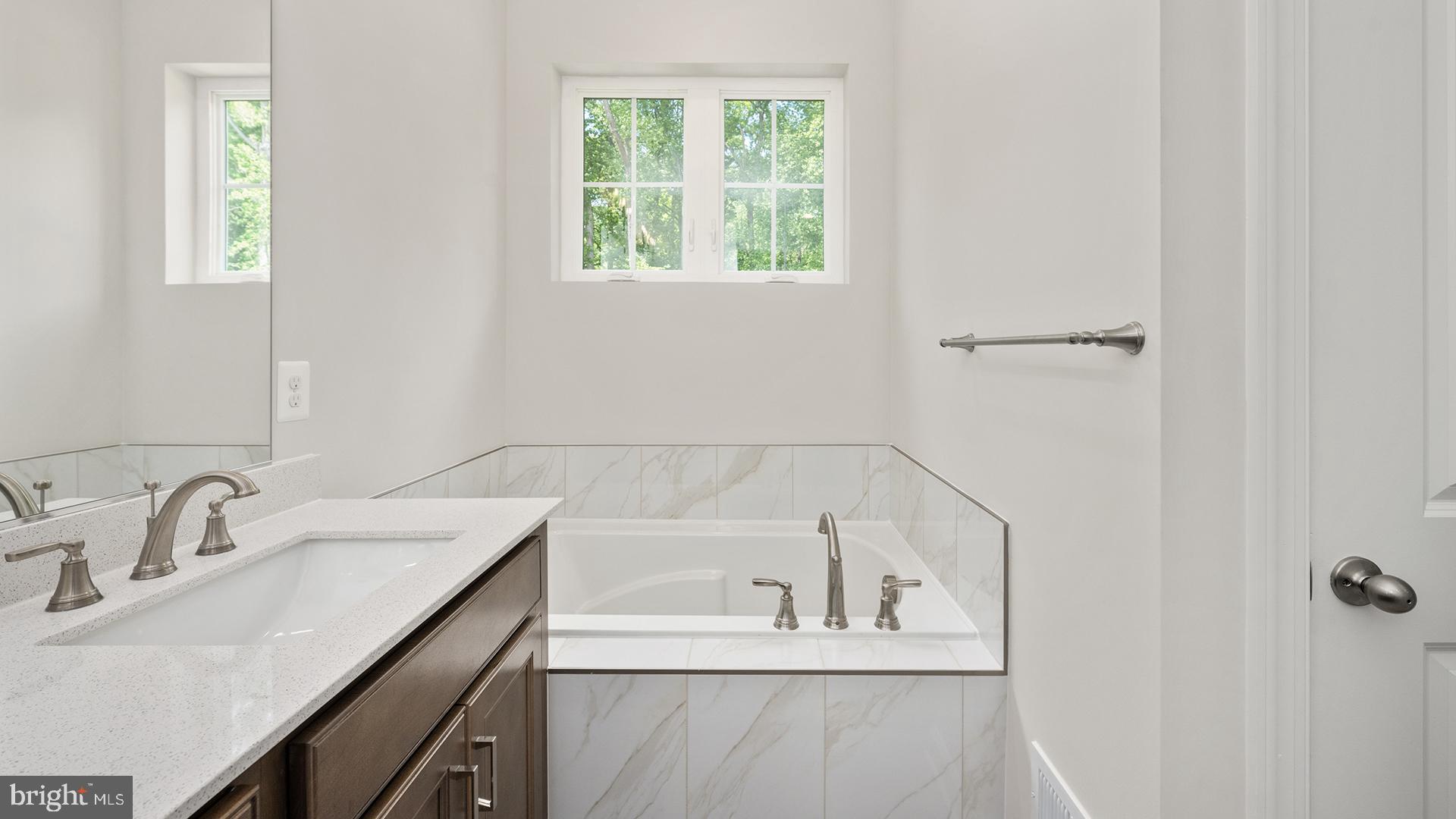 14018 Northern Vw Road Culpeper, VA 22701 - Photo 12 of 27 a white bath tub sitting next to a white sink