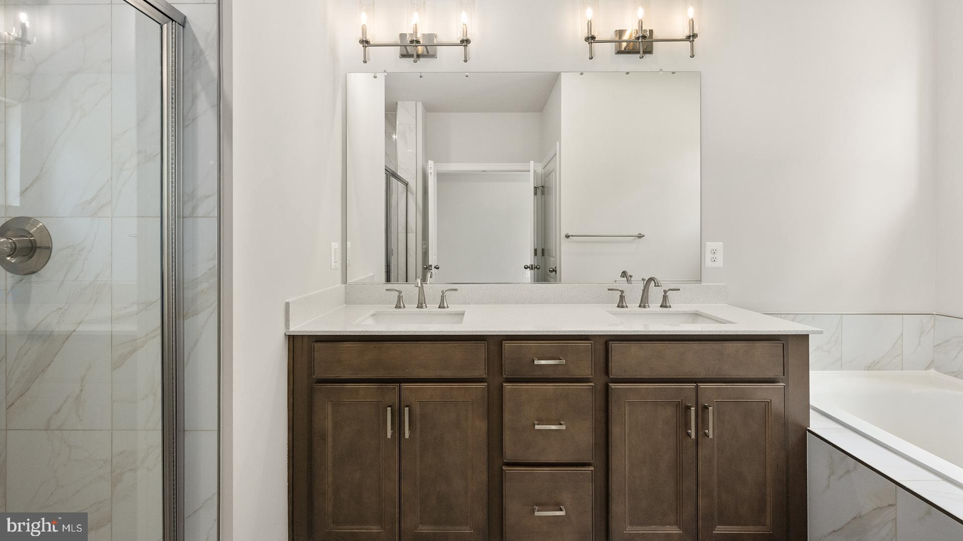 14018 Northern Vw Road Culpeper, VA 22701 - Photo 13 of 27 a bathroom with a sink and a mirror
