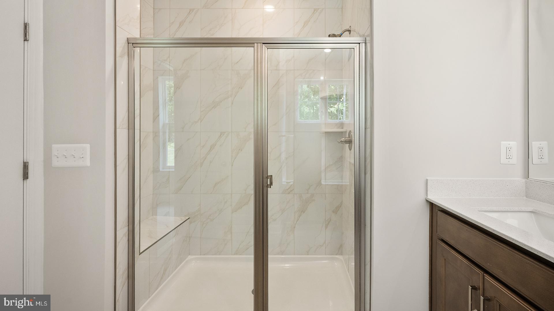 14018 Northern Vw Road Culpeper, VA 22701 - Photo 14 of 27 a bathroom with a granite countertop shower and a sink