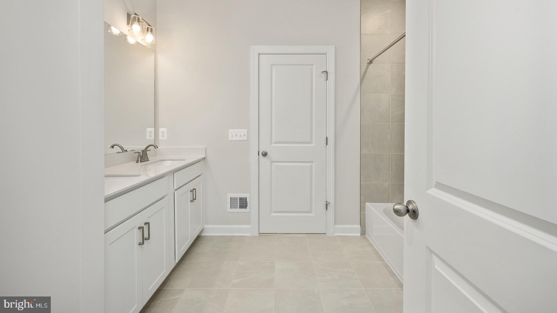 14018 Northern Vw Road Culpeper, VA 22701 - Photo 16 of 27 a bathroom with a granite countertop sink tub and a mirror