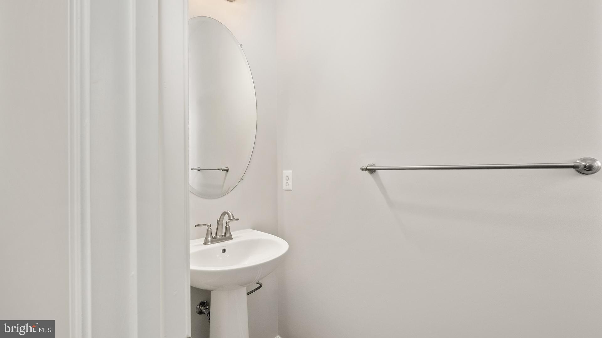 14018 Northern Vw Road Culpeper, VA 22701 - Photo 9 of 27 a bathroom with a sink a mirror and a shower