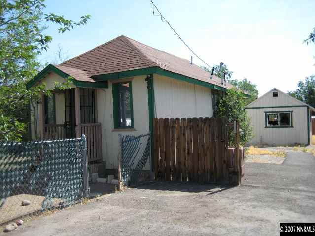 1000 Sutro Street, Unit 2 Reno, NV 89512 - Photo 1 of 1 a front view of a house with a garage