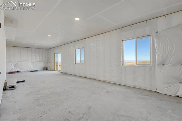 a view of water heater room with hallway