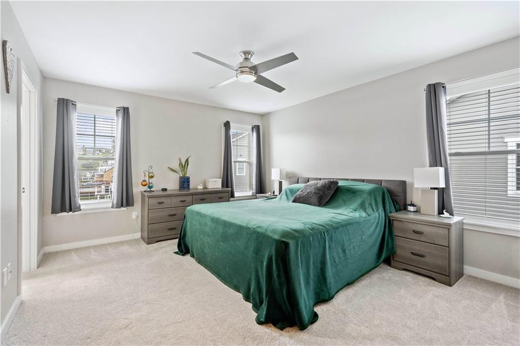 414 Friday Road Pittsburgh, PA 15209 - Photo 12 of 24 a bedroom with a bed and windows
