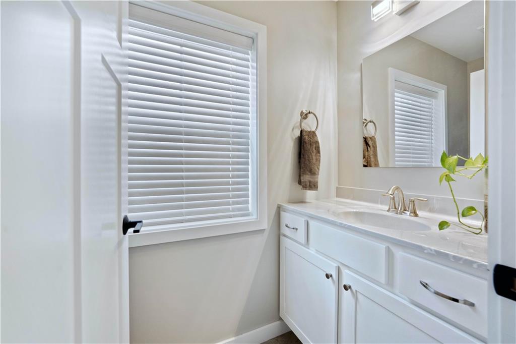 414 Friday Road Pittsburgh, PA 15209 - Photo 23 of 24 a bathroom with a sink and a mirror