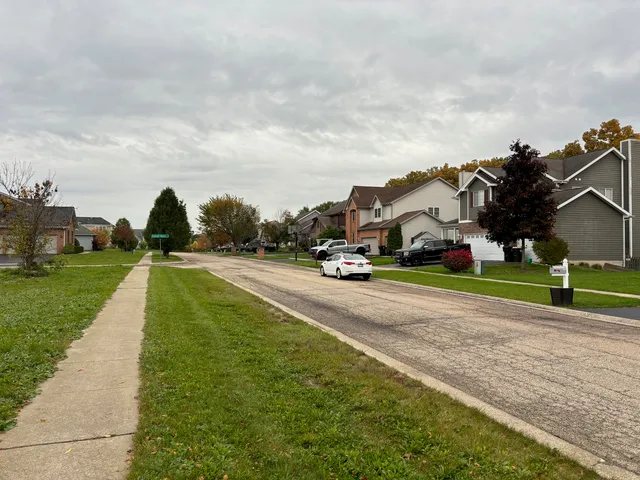 a view of a playground with basketball court