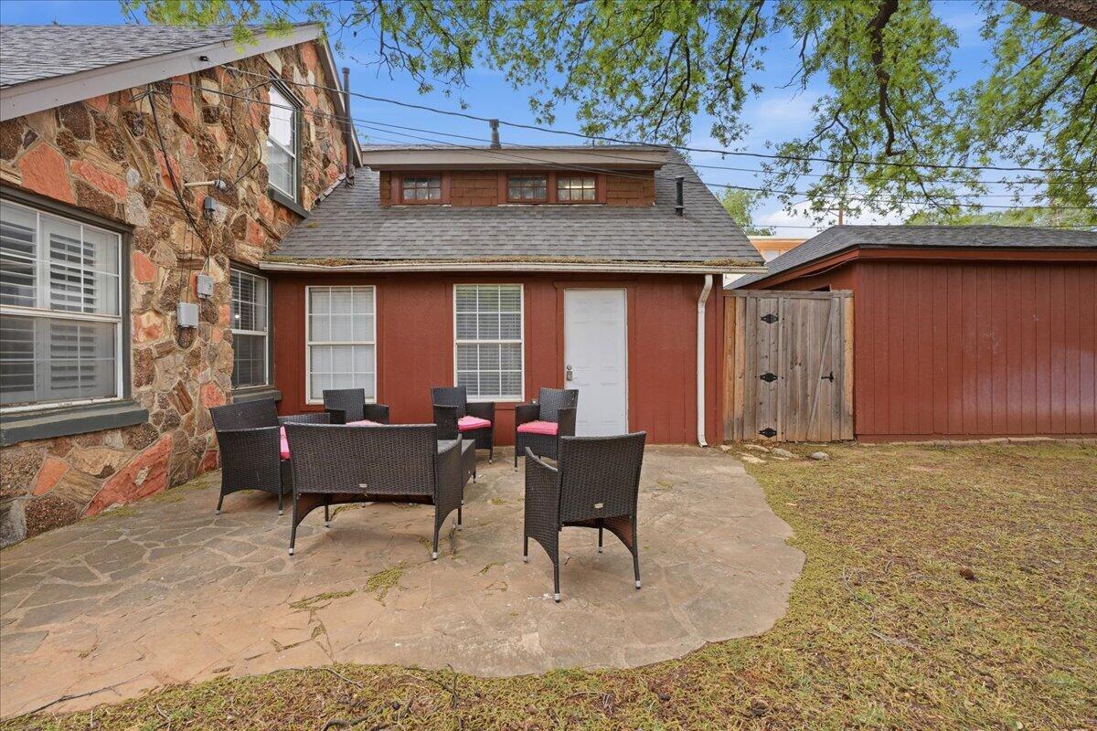 2702 20th Street Lubbock, TX 79410 - Photo 31 of 34 a view of a house with backyard and sitting area