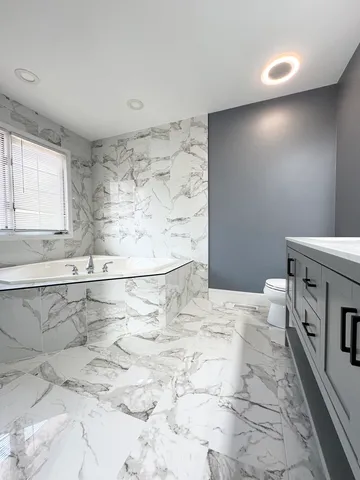 a bathroom with a sink a toilet and a bathtub