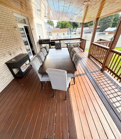 a view of a backyard with swimming pool