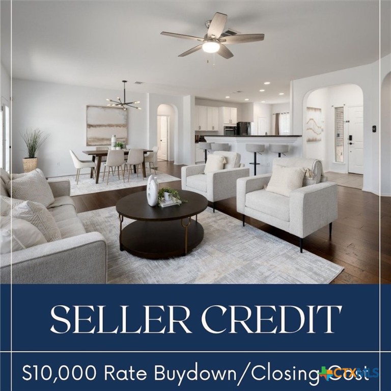 a view of living room with furniture and kitchen view