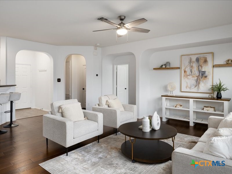 18817 Star Gazer Way Pflugerville, TX 78660 - Photo 12 of 36 a living room with furniture and a wooden floor