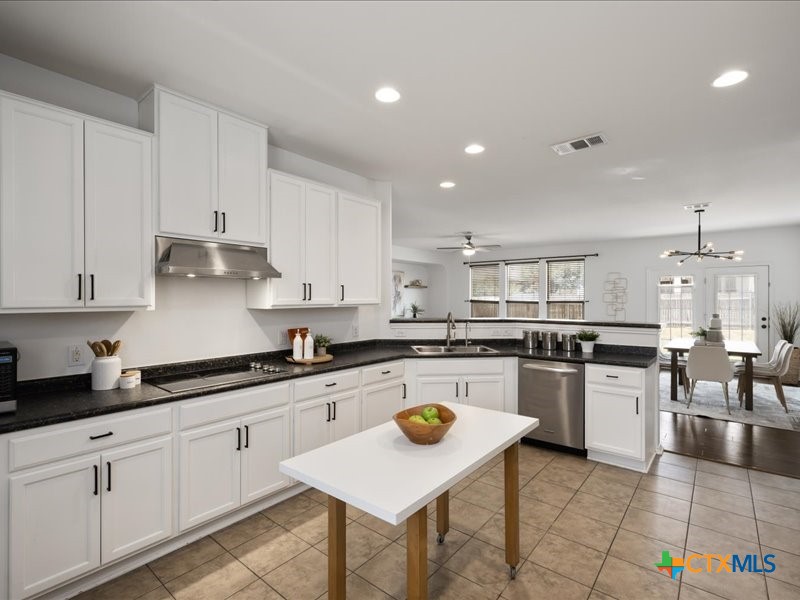 18817 Star Gazer Way Pflugerville, TX 78660 - Photo 18 of 36 a kitchen with lots of counter top space and kitchen view