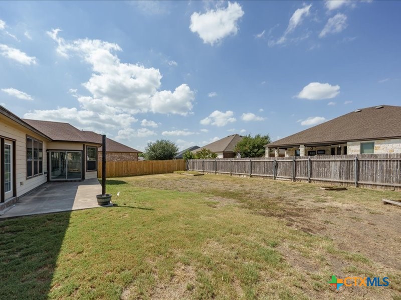 18817 Star Gazer Way Pflugerville, TX 78660 - Photo 30 of 36 a view of a house with a yard
