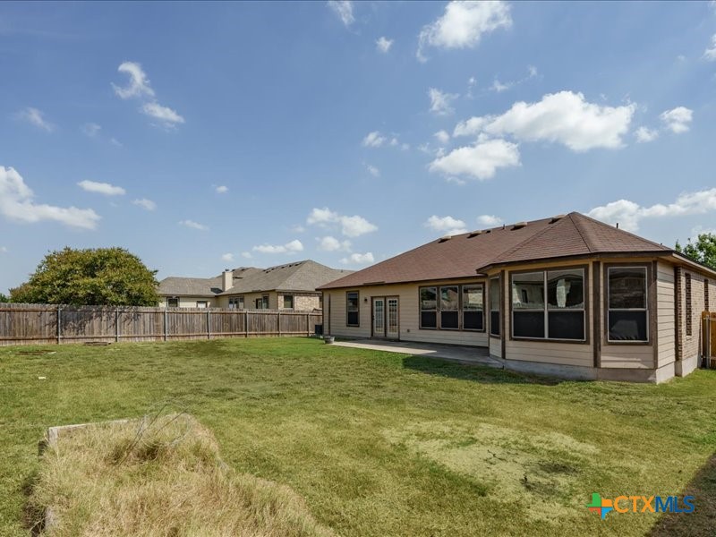 18817 Star Gazer Way Pflugerville, TX 78660 - Photo 33 of 36 a view of a house with a garden and yard