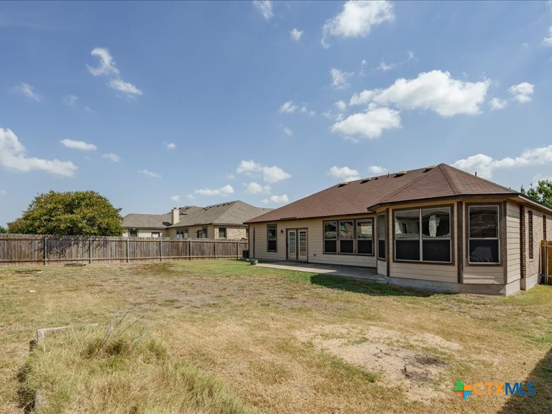 18817 Star Gazer Way Pflugerville, TX 78660 - Photo 34 of 36 a front view of a house with a garden