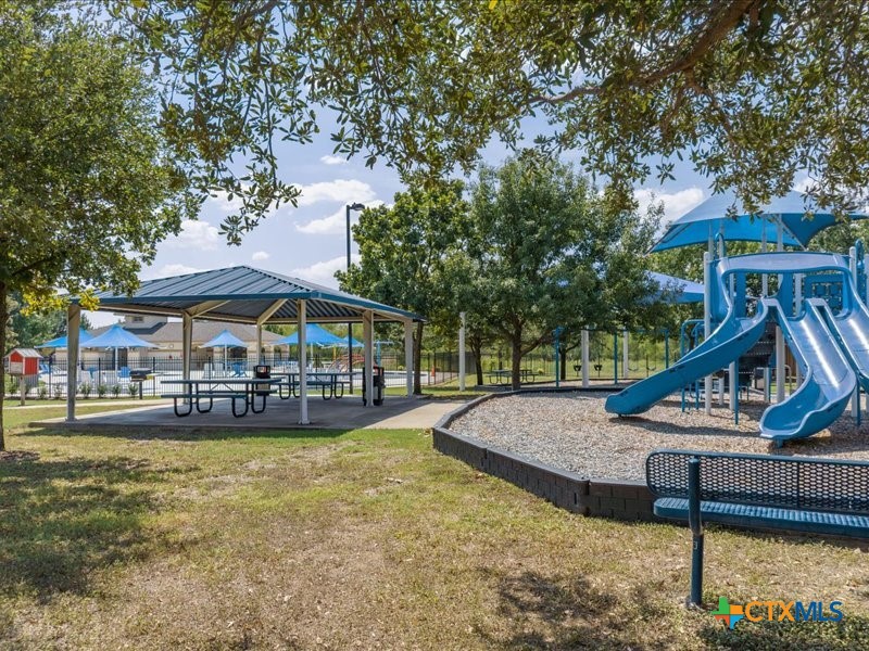 18817 Star Gazer Way Pflugerville, TX 78660 - Photo 35 of 36 a view of a house with swimming pool and sitting area