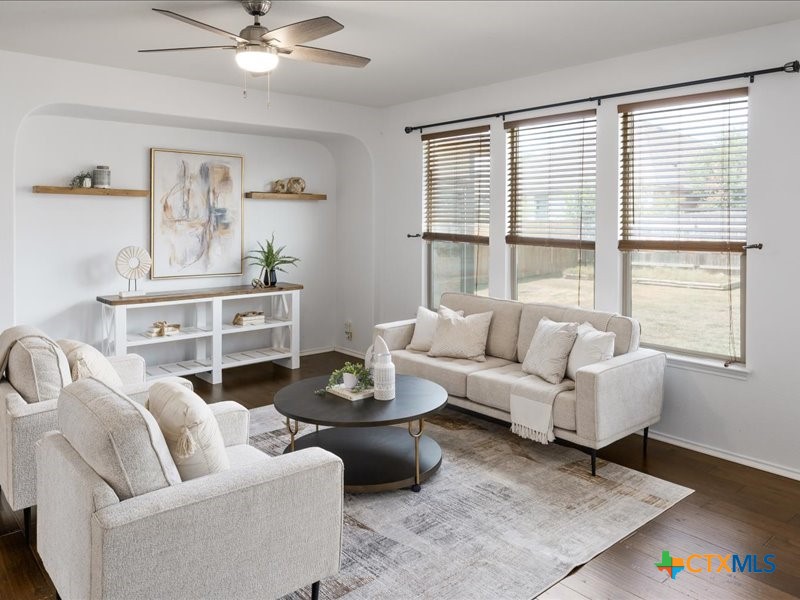 18817 Star Gazer Way Pflugerville, TX 78660 - Photo 10 of 36 a living room with furniture and a large window