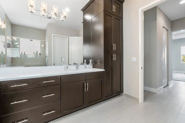 a bathroom with a double vanity sink and a mirror