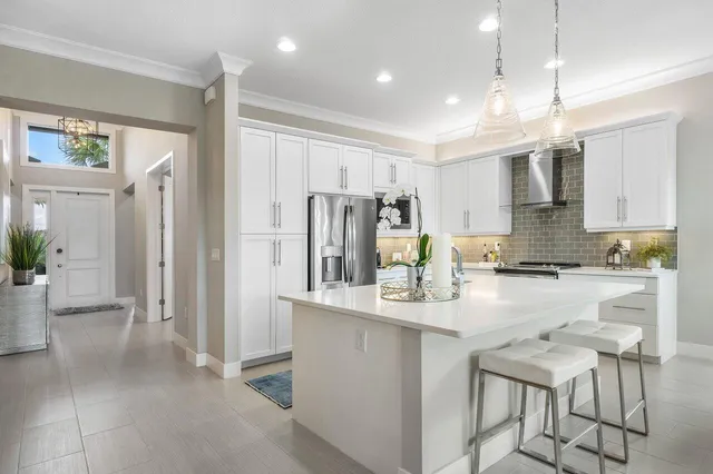 a kitchen with refrigerator cabinets and a counter top space