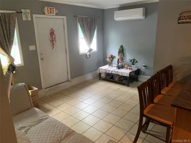 a view of a hallway with seating area