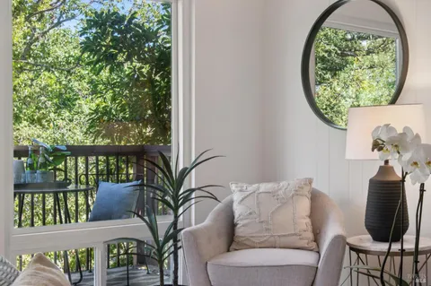 a view of a balcony with chairs