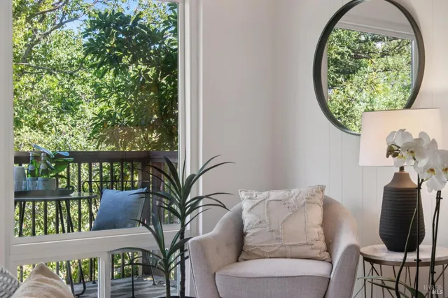 a view of a balcony with chairs