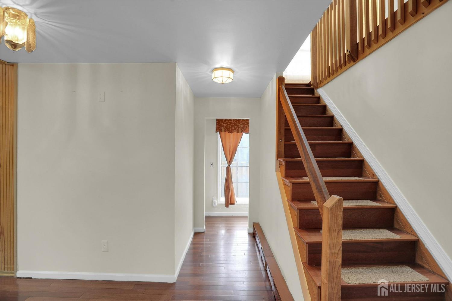 434 Ridge Road Dayton, NJ 08810 - Photo 11 of 46 a view of entryway and hall with wooden floor
