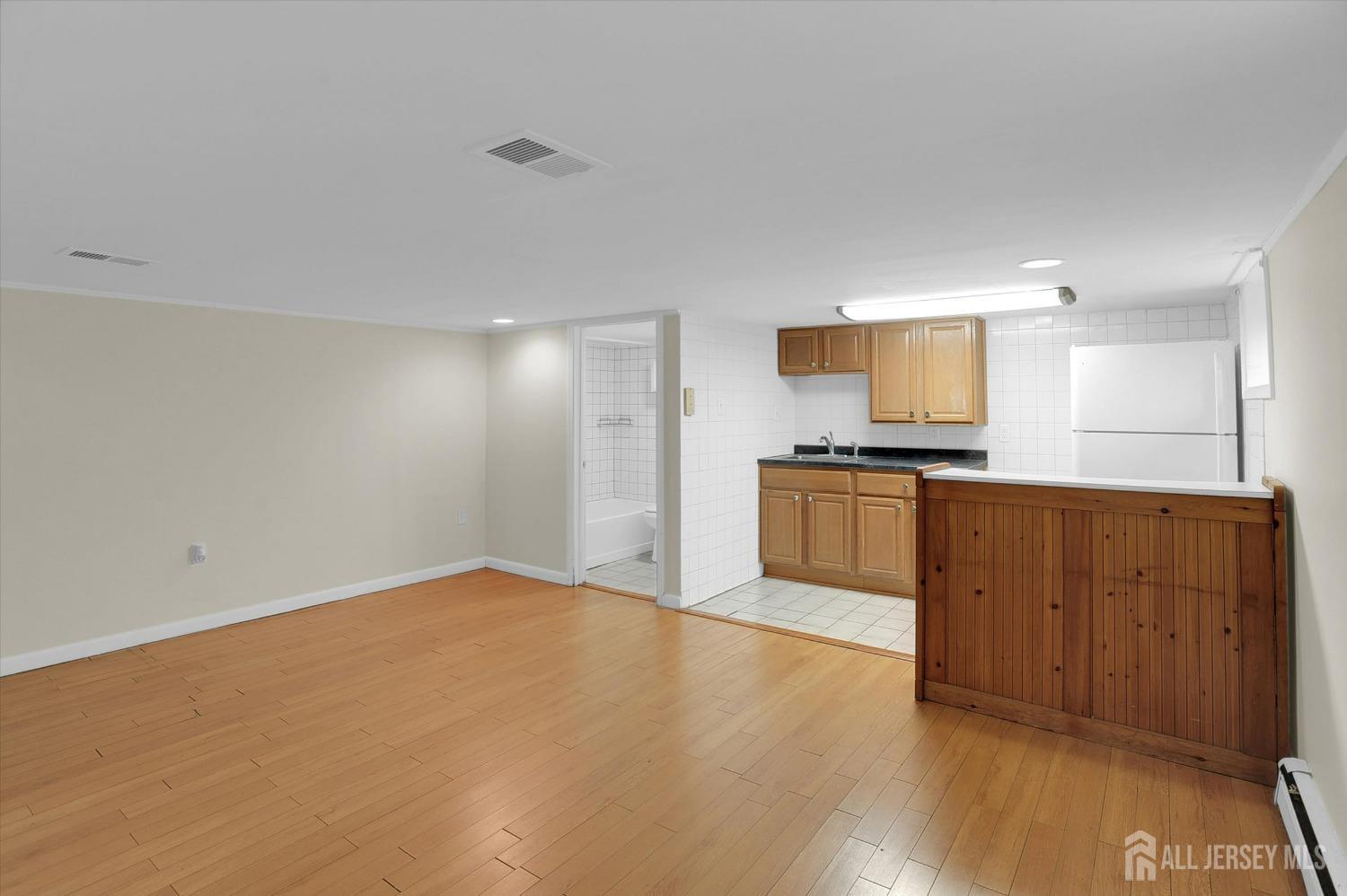 434 Ridge Road Dayton, NJ 08810 - Photo 13 of 46 a view of kitchen with wooden floor