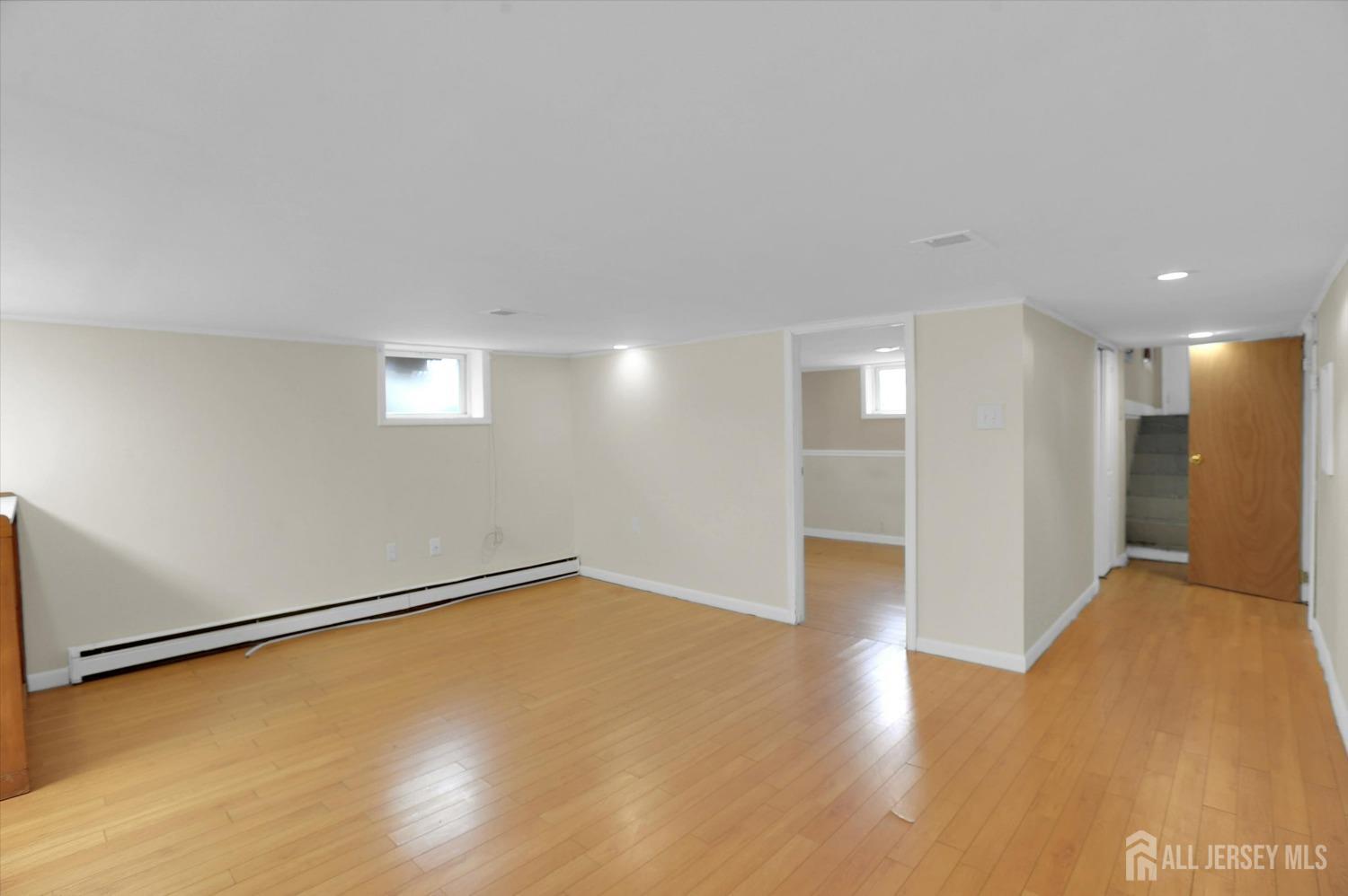 434 Ridge Road Dayton, NJ 08810 - Photo 14 of 46 a view of an empty room with wooden floor