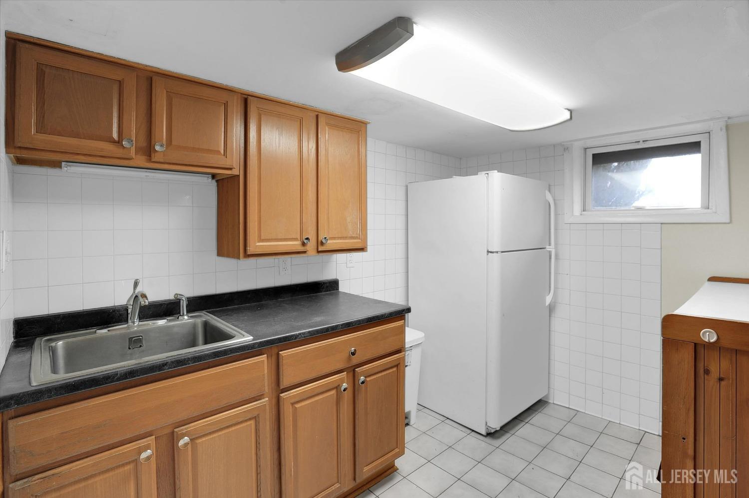 434 Ridge Road Dayton, NJ 08810 - Photo 15 of 46 a kitchen with stainless steel appliances granite countertop a refrigerator a sink and dishwasher