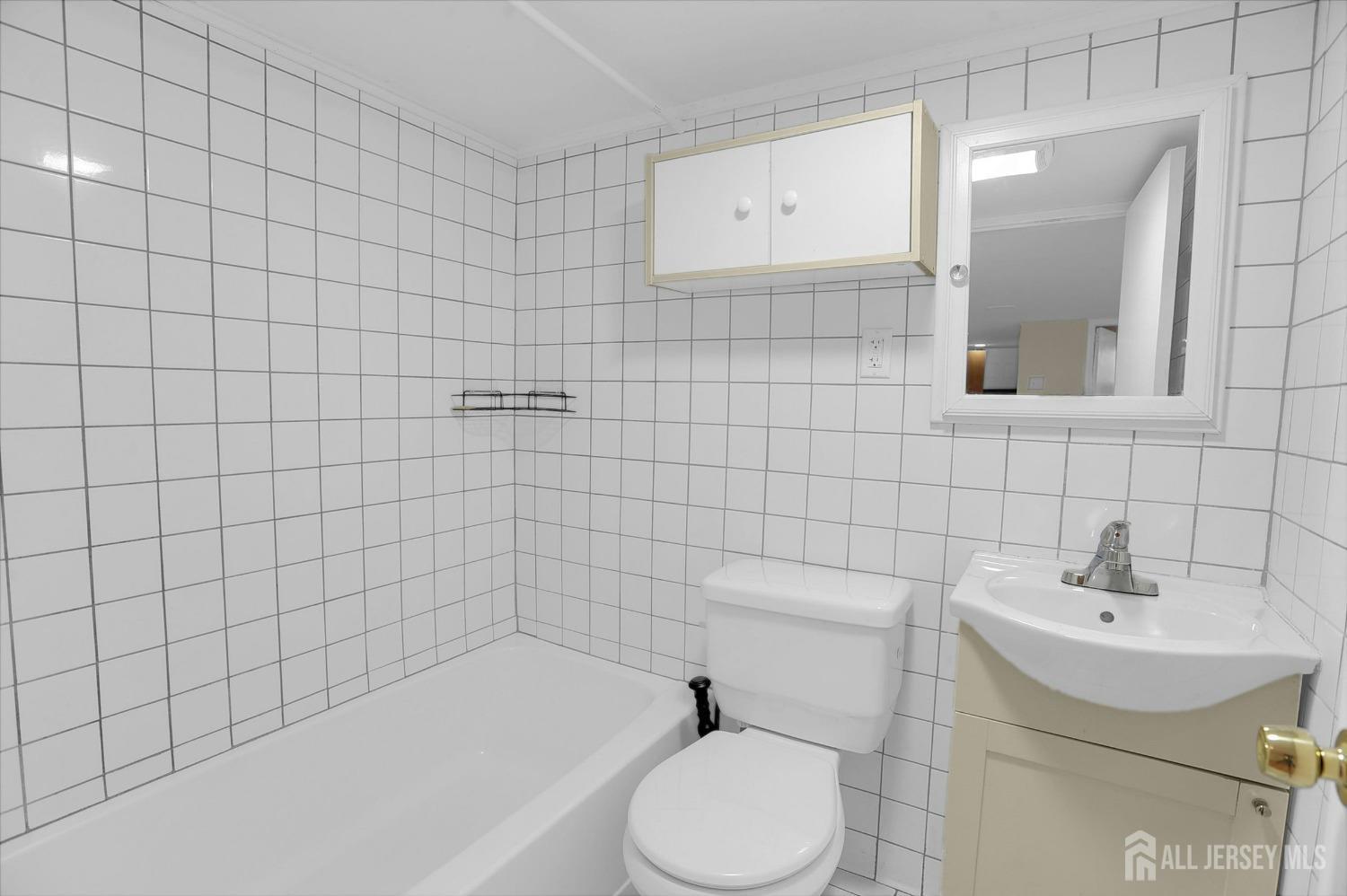 434 Ridge Road Dayton, NJ 08810 - Photo 17 of 46 a bathroom with a sink toilet and shower