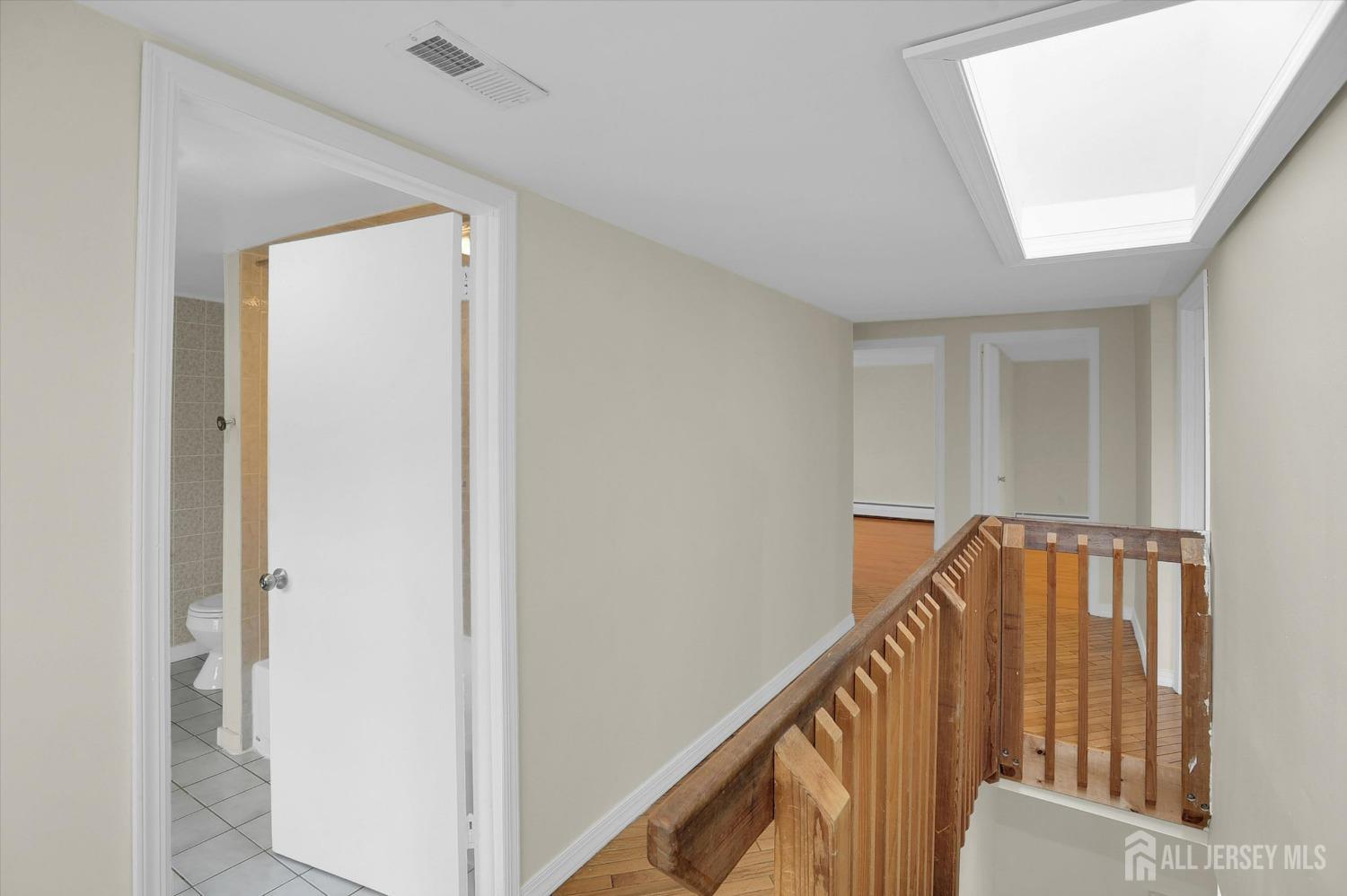 434 Ridge Road Dayton, NJ 08810 - Photo 21 of 46 a view of staircase with railing and white walls