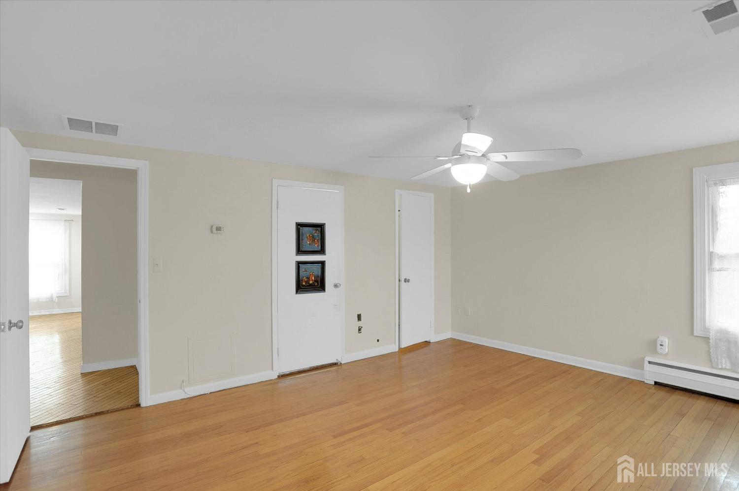 434 Ridge Road Dayton, NJ 08810 - Photo 22 of 46 a view of a livingroom with a chandelier fan and window