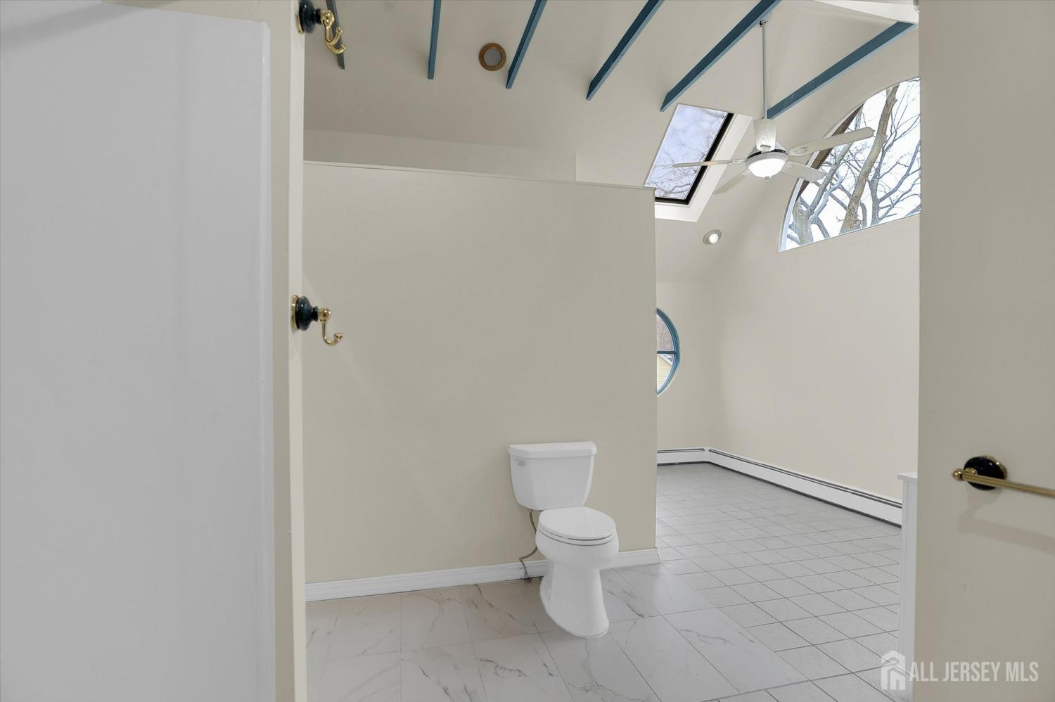 434 Ridge Road Dayton, NJ 08810 - Photo 24 of 46 a white toilet sitting next to a white wall